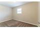 Simple bedroom with window and neutral wall color at 8661 Chestnut Ln, Lithia Springs, GA 30122