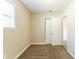 Small bedroom with closet and neutral decor at 8661 Chestnut Ln, Lithia Springs, GA 30122