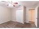 Bright bedroom featuring a double door closet and ceiling fan at 8661 Chestnut Ln, Lithia Springs, GA 30122
