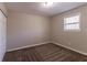 Bright bedroom with neutral walls and brown carpeting at 8661 Chestnut Ln, Lithia Springs, GA 30122