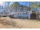 Gray brick ranch house with a landscaped yard at 8661 Chestnut Ln, Lithia Springs, GA 30122