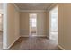 Bright hallway with access to multiple rooms at 8661 Chestnut Ln, Lithia Springs, GA 30122
