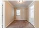 Carpeted hallway with access to exterior and other rooms at 8661 Chestnut Ln, Lithia Springs, GA 30122