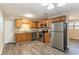 Updated kitchen with stainless steel appliances and granite countertops at 8661 Chestnut Ln, Lithia Springs, GA 30122