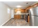 Updated kitchen with stainless steel appliances and granite countertops at 8661 Chestnut Ln, Lithia Springs, GA 30122