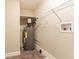 Laundry room with shelving, water heater and hookups at 8661 Chestnut Ln, Lithia Springs, GA 30122