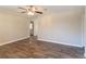 Living room with wood-look flooring and ceiling fan at 8661 Chestnut Ln, Lithia Springs, GA 30122