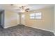 Living room with wood-look floors, white door, and window at 8661 Chestnut Ln, Lithia Springs, GA 30122