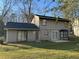 The backyard features sliding glass doors and a small concrete patio at 1654 Tree Line Rd, Lithonia, GA 30058