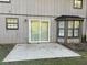 The back of the home showcases a sliding door, windows, and a patio area at 1654 Tree Line Rd, Lithonia, GA 30058