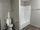 Bathroom with toilet, bathtub, and tiled walls at 1654 Tree Line Rd, Lithonia, GA 30058