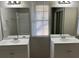 Double vanity bathroom with large mirrors and window at 1654 Tree Line Rd, Lithonia, GA 30058