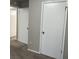 Bedroom with carpeted floors and multiple doors at 1654 Tree Line Rd, Lithonia, GA 30058