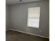 Simple bedroom featuring neutral gray walls and carpeted flooring at 1654 Tree Line Rd, Lithonia, GA 30058