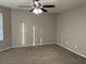 Empty bedroom with a ceiling fan and carpeted floors at 1654 Tree Line Rd, Lithonia, GA 30058