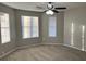 Spacious bedroom with large windows and a ceiling fan at 1654 Tree Line Rd, Lithonia, GA 30058