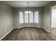 Dining room with large bay window, chandelier, and wood-look flooring at 1654 Tree Line Rd, Lithonia, GA 30058