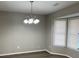 Dining room with bay window, chandelier, and wood-look flooring at 1654 Tree Line Rd, Lithonia, GA 30058
