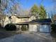 Two-story home with a two-car garage and a concrete driveway at 1654 Tree Line Rd, Lithonia, GA 30058