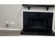 Black tile fireplace with white trim and a wood mantel at 1654 Tree Line Rd, Lithonia, GA 30058