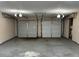 Spacious two-car garage with gray floor and beige walls at 1654 Tree Line Rd, Lithonia, GA 30058