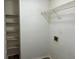 Laundry room with shelving, washer/dryer hookups, and wood-look flooring at 1654 Tree Line Rd, Lithonia, GA 30058