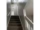 Carpeted stairs with white railing leading to the upper level at 1654 Tree Line Rd, Lithonia, GA 30058