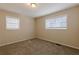 Well-lit bedroom with neutral walls and carpet at 4731 Kings Hwy, Douglasville, GA 30135