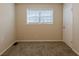 Simple bedroom with window and carpet flooring at 4731 Kings Hwy, Douglasville, GA 30135