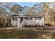 Brick ranch house with a landscaped lawn and walkway at 4731 Kings Hwy, Douglasville, GA 30135