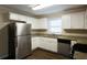Modern kitchen with stainless steel appliances and granite countertops at 4731 Kings Hwy, Douglasville, GA 30135