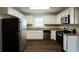 Modern kitchen with stainless steel appliances and granite countertops at 4731 Kings Hwy, Douglasville, GA 30135