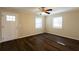 Living room with hardwood floors, ceiling fan and front door entry at 4731 Kings Hwy, Douglasville, GA 30135