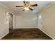 Living room with hardwood floors, ceiling fan, and access to kitchen at 4731 Kings Hwy, Douglasville, GA 30135