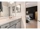 Modern bathroom with gray vanity and bedroom access at 1250 Parkwood Se Cir, Atlanta, GA 30339