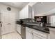 Modern kitchen with white cabinets, granite counters, and stainless steel appliances at 1250 Parkwood Se Cir, Atlanta, GA 30339