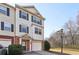 Two-story townhome with brick and siding exterior, attached garage, and landscaping at 6798 Blackstone Pl # 12, Mableton, GA 30126