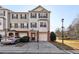 Two-story townhome with brick and siding exterior, attached garage, and landscaping at 6798 Blackstone Pl # 12, Mableton, GA 30126