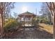 Wooden gazebo nestled in a landscaped backyard at 6798 Blackstone Pl # 12, Mableton, GA 30126