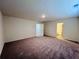 Spacious bedroom with ensuite bathroom and carpeted flooring at 7709 Sudbury Cir, Covington, GA 30014