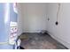 Unfinished basement area with water heater and concrete floor at 2329 Meadowlane Sw Dr, Atlanta, GA 30311