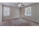 Bright bedroom with neutral walls, carpet, and two large windows at 2329 Meadowlane Sw Dr, Atlanta, GA 30311