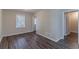 Spacious bedroom with dark gray vinyl flooring and neutral-toned walls at 2329 Meadowlane Sw Dr, Atlanta, GA 30311