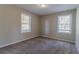 Simple bedroom featuring two windows and neutral wall colors at 2329 Meadowlane Sw Dr, Atlanta, GA 30311