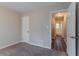 Bedroom with access to a shared bathroom and an additional closet at 2329 Meadowlane Sw Dr, Atlanta, GA 30311