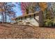 Tan brick ranch home with a covered carport and steps leading to the front door at 2329 Meadowlane Sw Dr, Atlanta, GA 30311