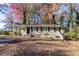 Tan brick ranch home with a covered carport and steps leading to the front door at 2329 Meadowlane Sw Dr, Atlanta, GA 30311