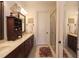 Double vanity bathroom with a large shower and view of the bedroom at 351 Washington Ne Ave # 208, Marietta, GA 30060