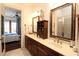 Double vanity bathroom with a large shower and view into the bedroom at 351 Washington Ne Ave # 208, Marietta, GA 30060