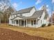 White house exterior showcasing a large covered patio area at 2216A E Cherokee Dr, Woodstock, GA 30115